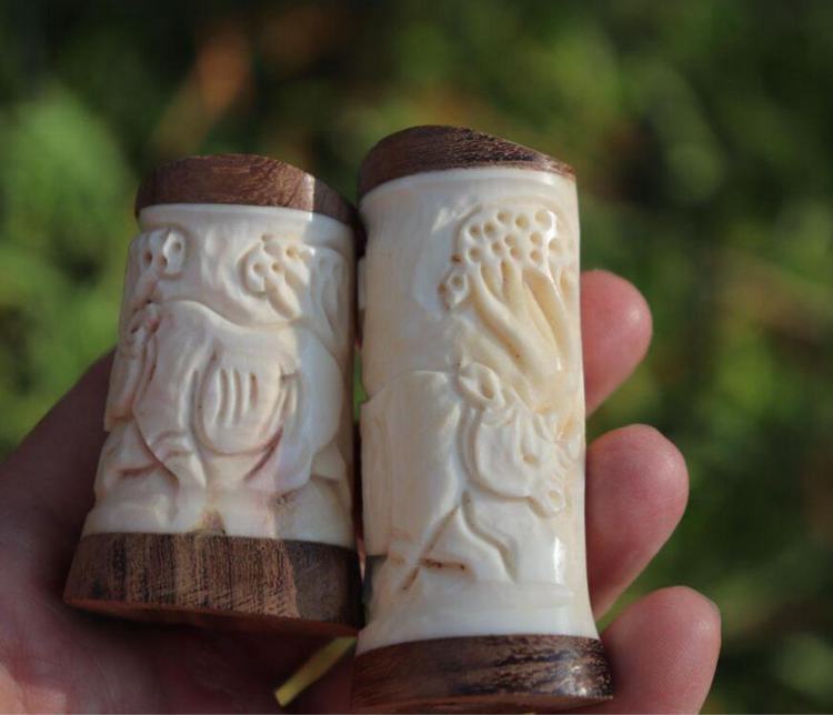 3. Set of Carved Ivory and Wood Salt and Pepper shakers