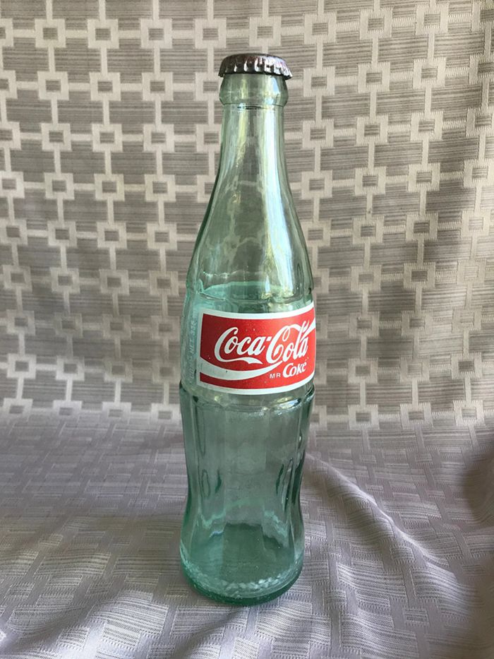 7. Antique Coca-Cola Mr. Coke Bottle