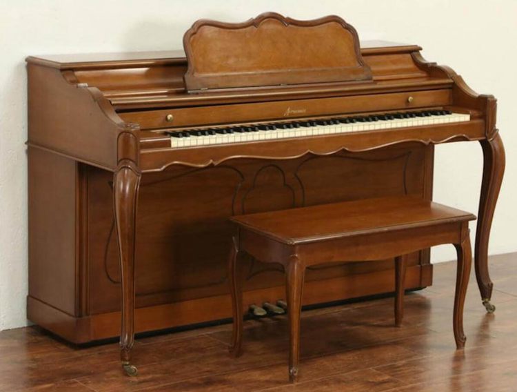 A Spinet Piano and a Bench
