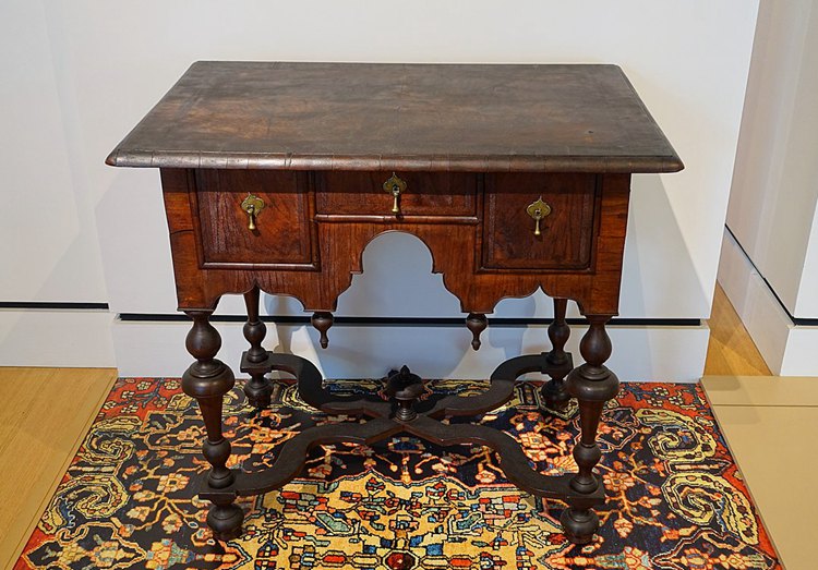 A William and Mary-style table with drawers