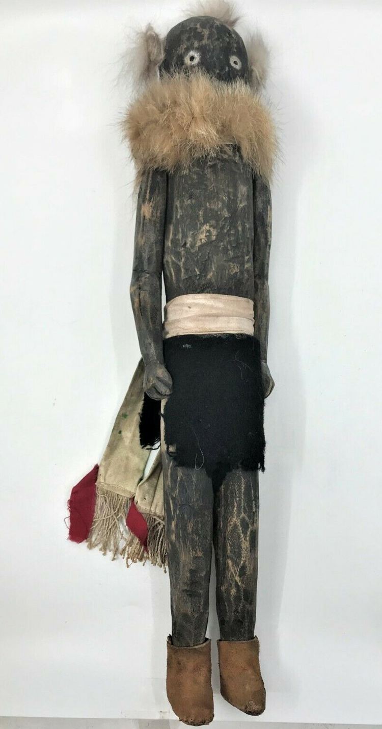 A traditional kachina doll with white beards