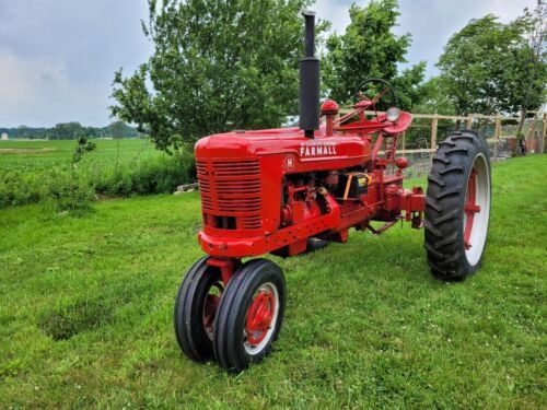 Red Farmall tractor on the field