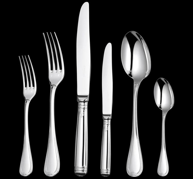 Silver plated flatware set with two forks, two spoons, and two knives
