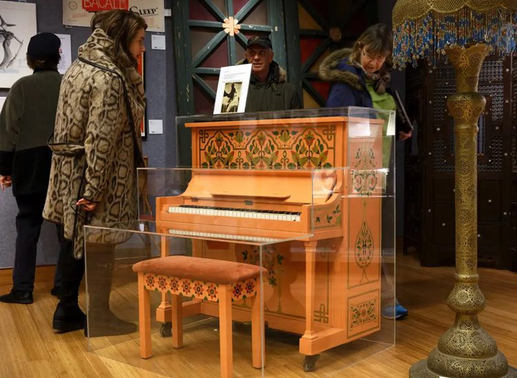 The Moroccan-Themed Casablanca Piano Encased in What Appears to Be Glass