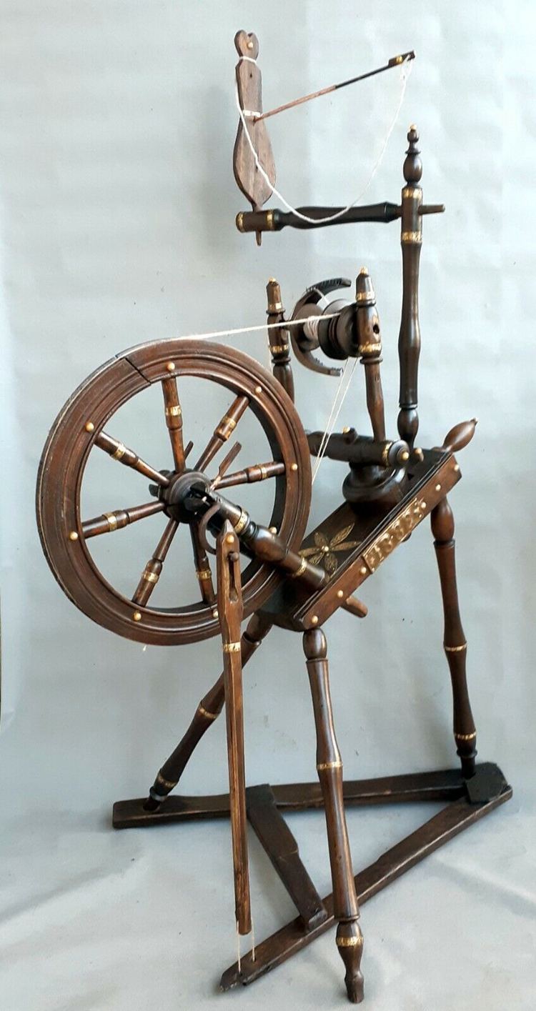 A unique, bronze detailed spinning wheel from the early 1888s