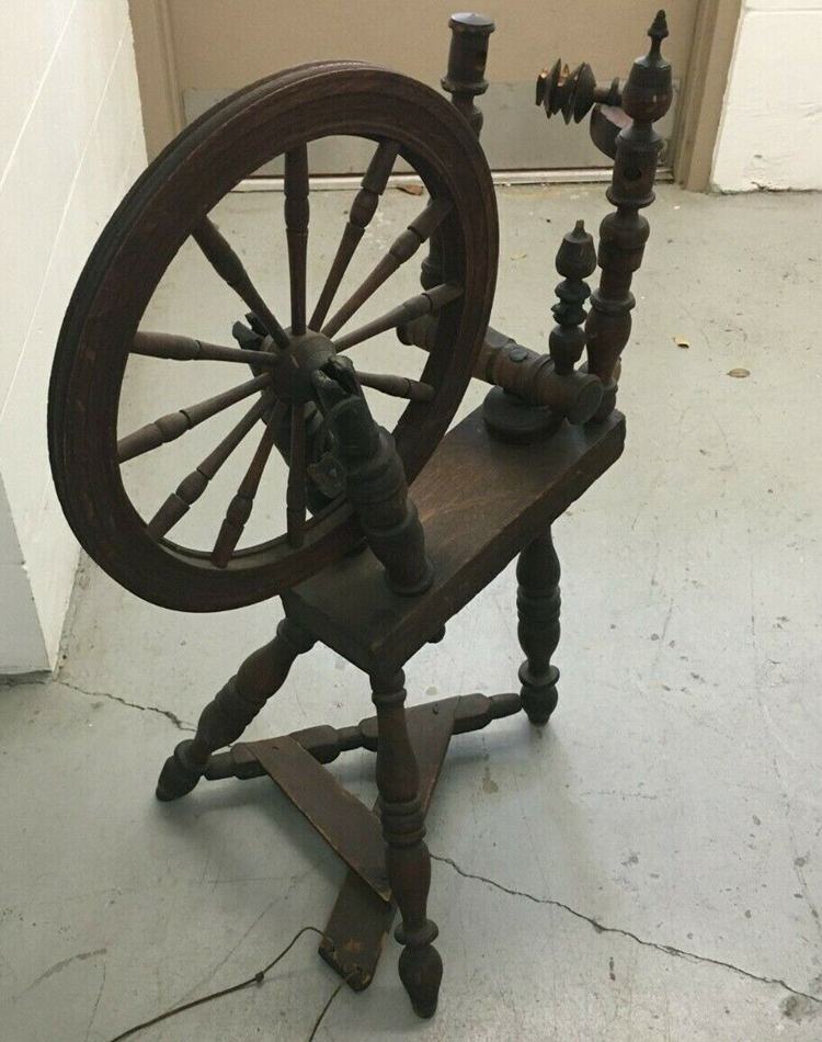 This 19th-century spinning wheel has a broken flayer