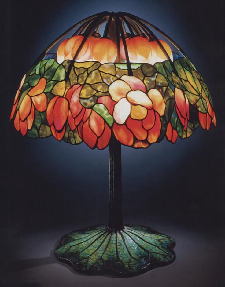 An antique high quality leaded glass, bronze and mosaic 'lotus' lamp sold for $2,807,500