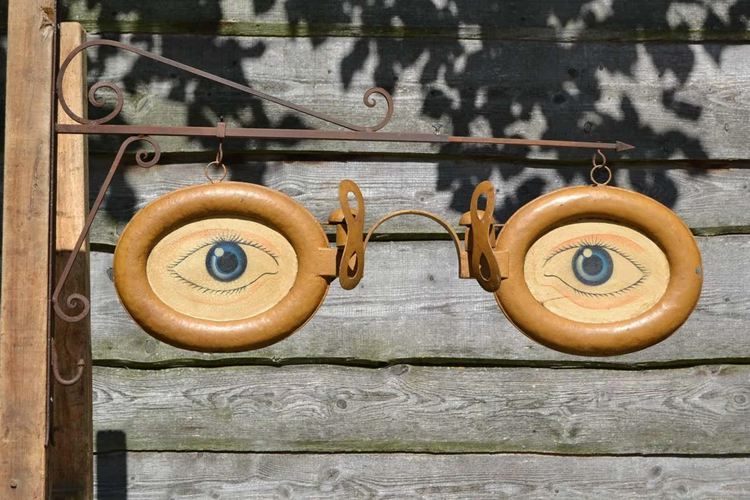Antique Optometrist trade sign Wall bracket Yellow eyeglasses