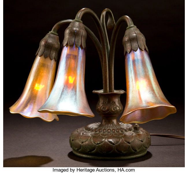Three-light bronze base with gold Favrile glass shades, circa 1910